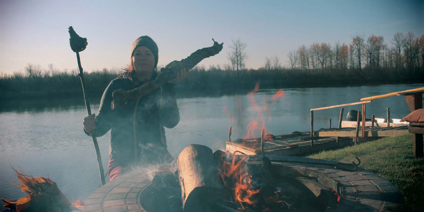 2022: Using Traditional Ecological Knowledge, Michela Carrière demonstrates how to make a fire torch in the Saskatchewan River Delta.